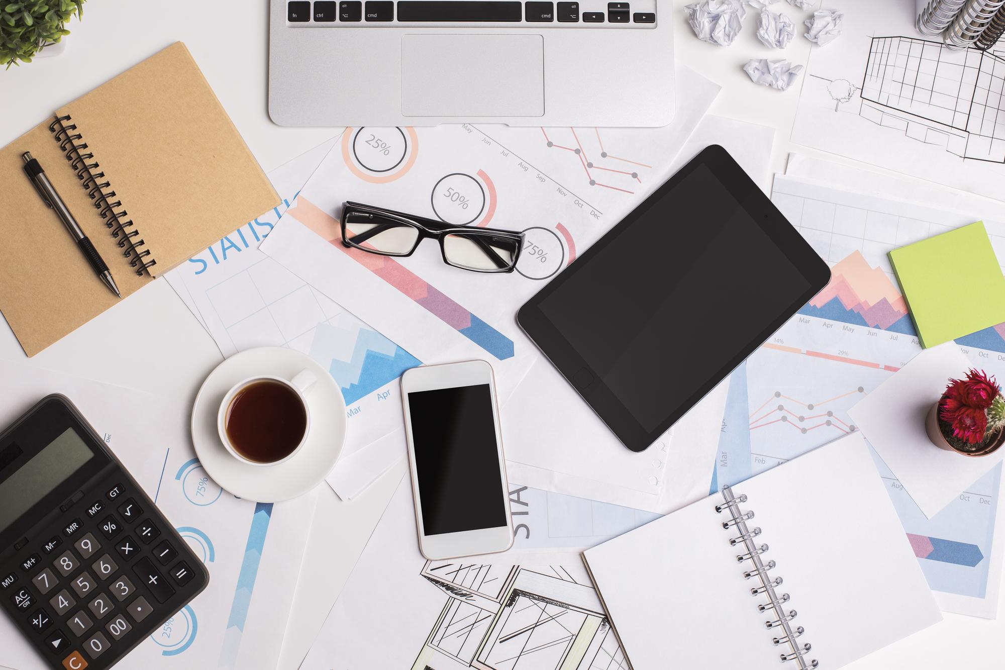 Studio workspace with financial reports and tools